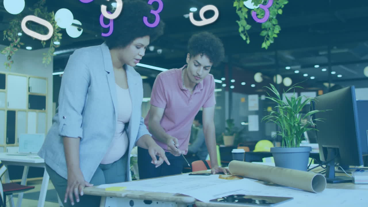 Numbers animation over two colleagues reviewing architectural plans in modern office