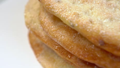 sweet flatbread with sugar on white surface. olive oil pita breads