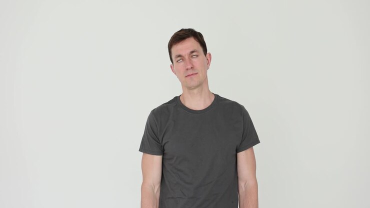 Man performing head tilts or neck stretches against a white background