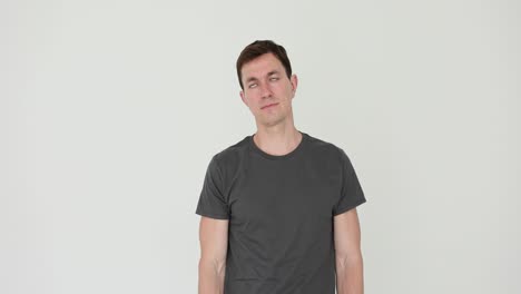 man performing head tilts or neck stretches against a white background