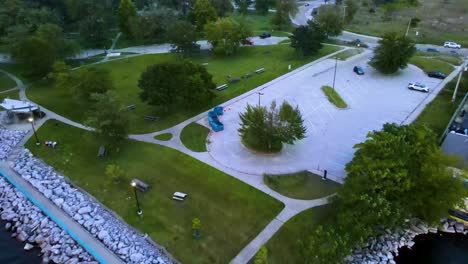 saturated edit. flydown with drone toward park