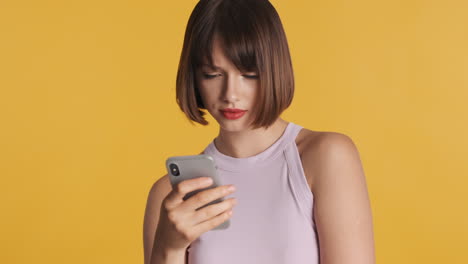 Upset-woman-watching-her-smartphone