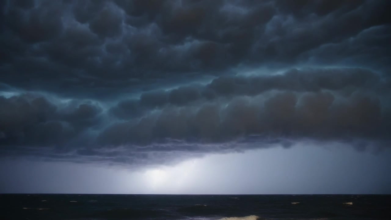Flashing lightning revealing shelf cloud bank shifting base over ocean, exposing rain curtain, foam