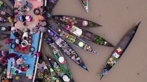 local people trading food at banjarmasin floating produce market, top down