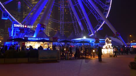 china night illumination hong kong city famous ferris wheel crowded panorama 4k