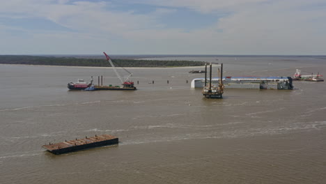 St-Simons-Georgia-Aerial-v7-pan-left-shot-of-overturned-cargo-ship,-St-Simons-Sound-and-island---March-2020