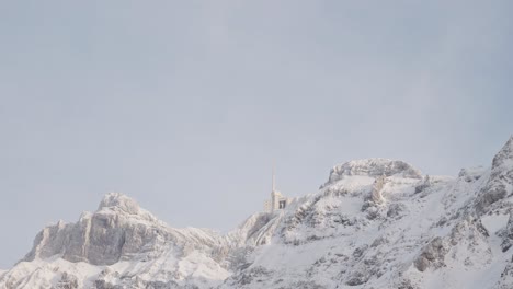 Swiss-Mountain-Saentis-in-the-alps-with-fresh-snow-and-fog