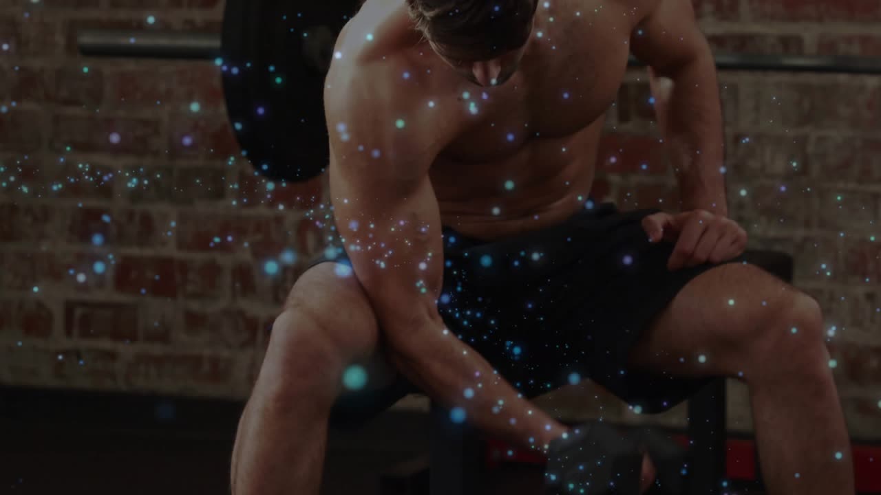 Man starting fitness workout with dumbbell, doing curls, flexing, smiling, sparkles over muscles