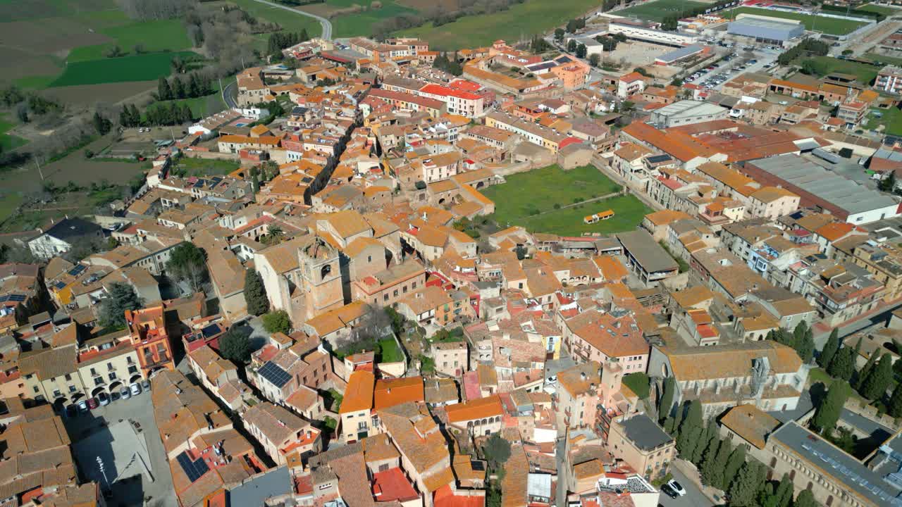 Peralada aerial view revealing historic peralada, medieval catalan town nestled amid verdant landscape, displaying traditional architecture and scenic urban layout in northeastern spain