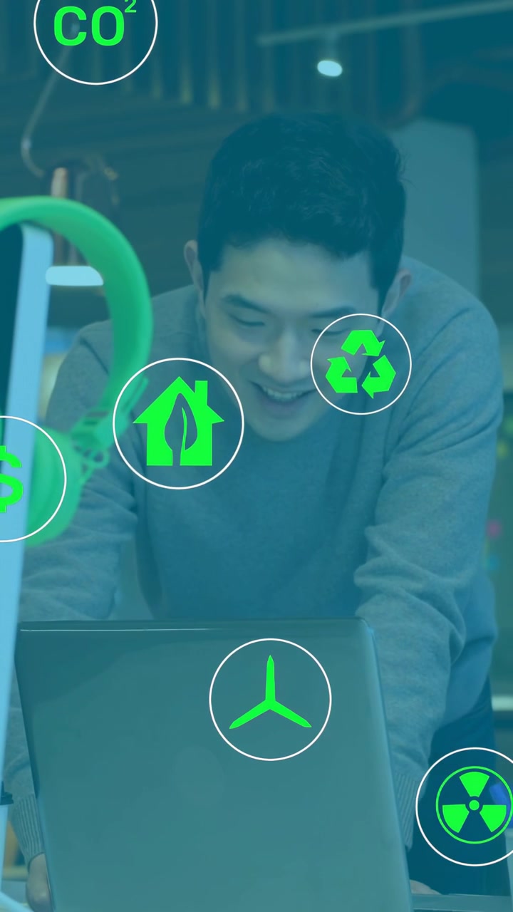 Vertical video: Man leaning laptop studying sustainability green icons appearing guiding click