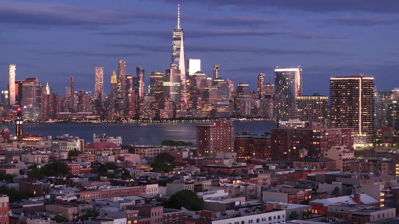 Aerial view of Lower Manhattan at night. Shot in Hoboken, New Jersey with the World Trade Center and the East River in the background.