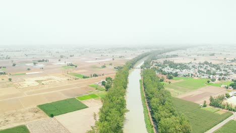 curved river near the fields in the province of punjab