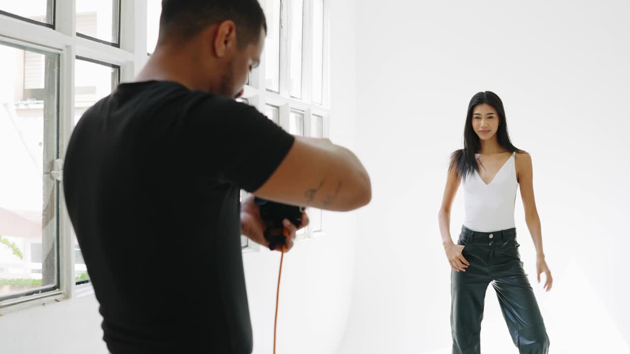 Studio photoshoot with a photographer and a model