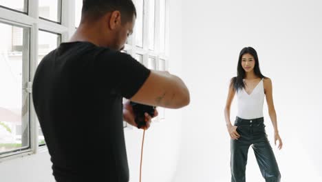 studio photoshoot with a photographer and a model