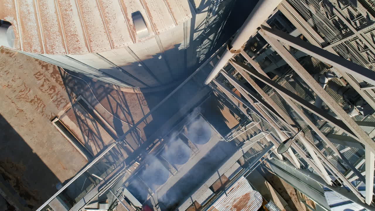 Grain elevator. Metal grain elevator in agricultural zone. Aerial view.