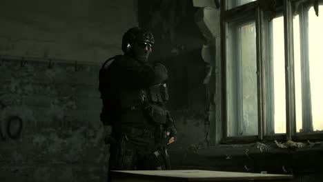 swat officer in a ruined building