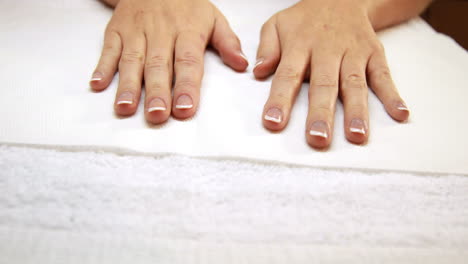 hands showing fresh french manicure