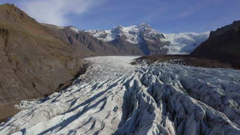 Aerial:-Flying-close-to-Svinafellsjokull-glacier-in-Iceland-during-a-sunny-day