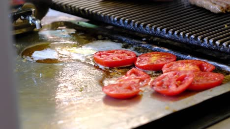 tomatoes are placed on the grill to cook