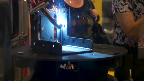 robot welding in a manufacturing setting