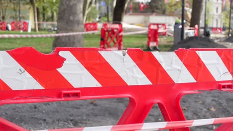 red and white barricade at a construction site