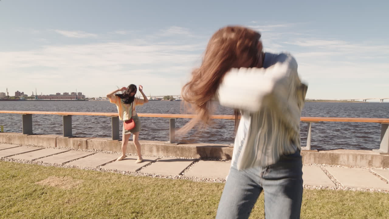 Girlfriends Partying Outdoors by River