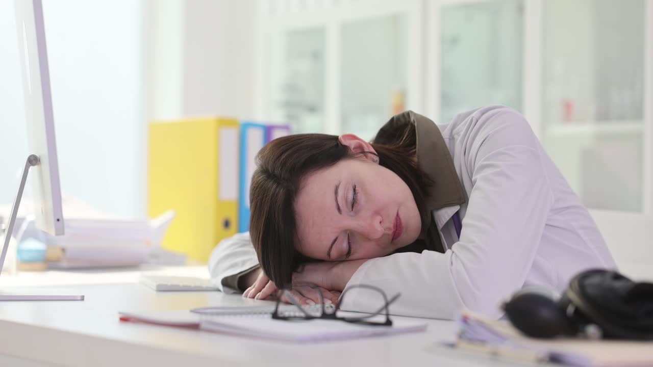 Tired Doctor Sleeping at Desk