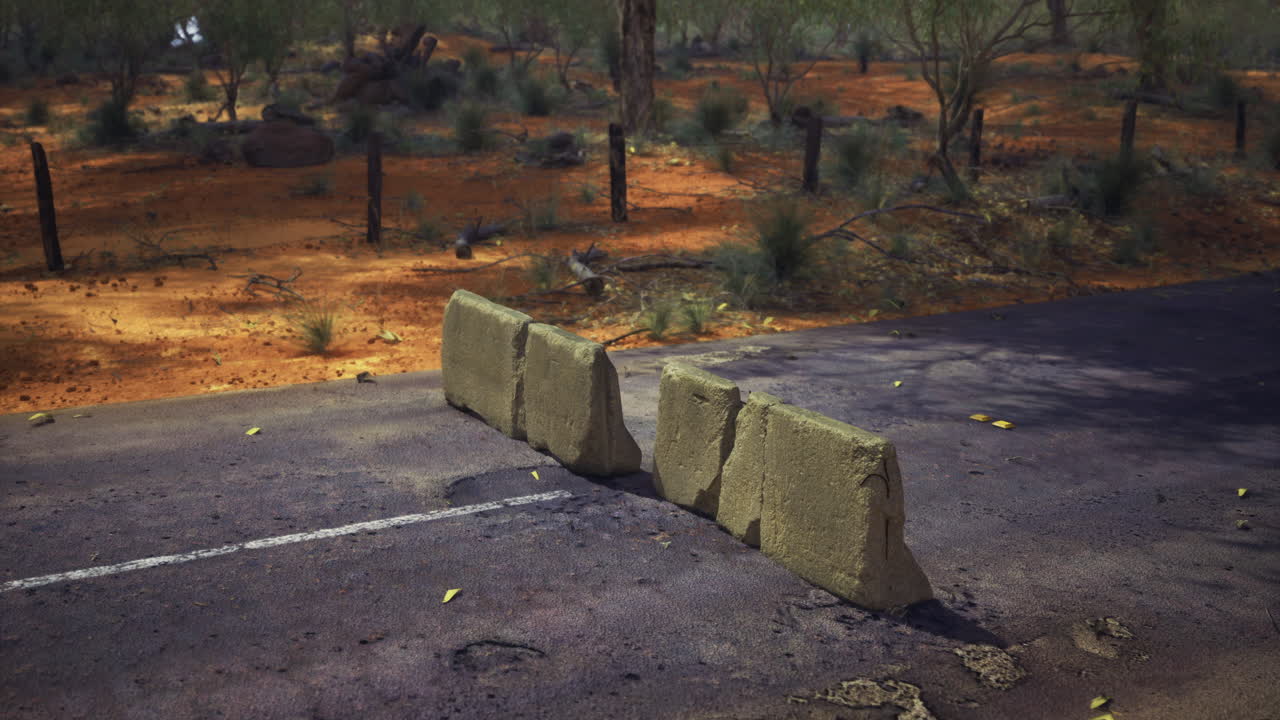 Roadblock in the heart of a barren landscape during golden hour light
