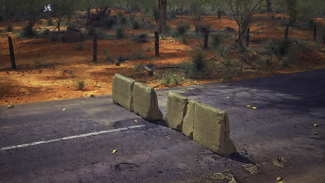 roadblock in the heart of a barren landscape during golden hour light