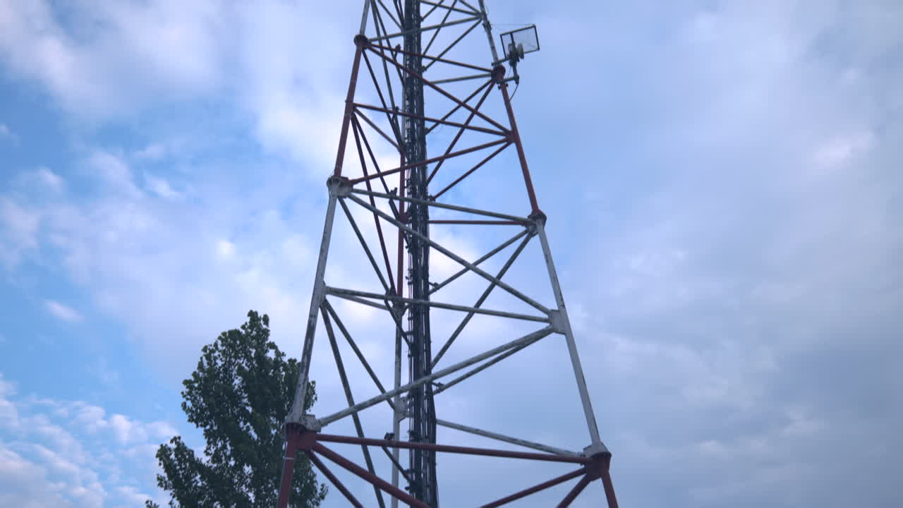 Antenna Telecommunication cell phone, radio transmitters of cellular 5g 4g mobile, smartphones, television and internet. View from the bottom up. Blue sky with white clouds