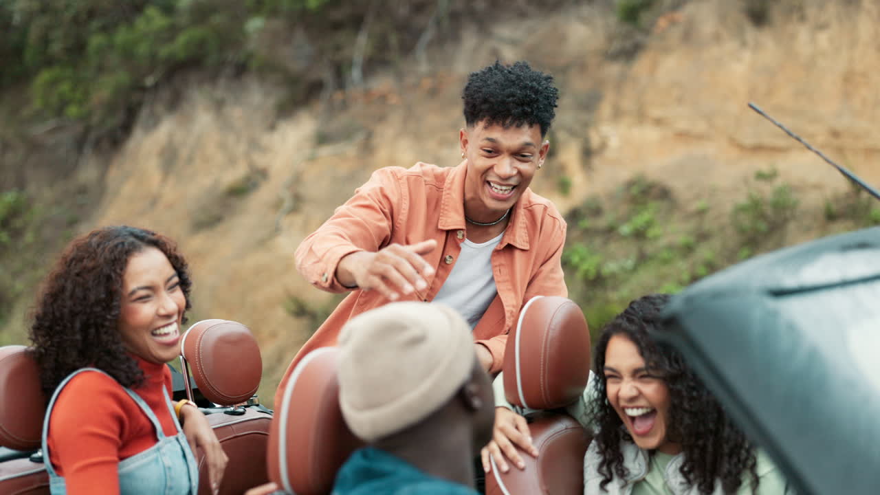 Friends enjoying a road trip in a convertible