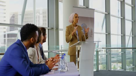 Female-speaker-speaking-in-a-business-seminar-4k