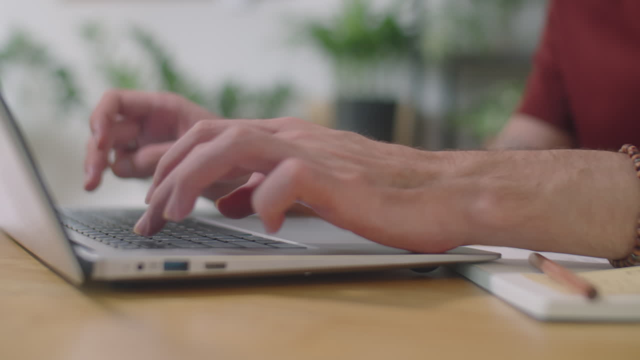 Hands of Office Clerk Typing on Laptop