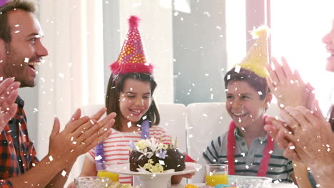 animation of confetti falling over family having fun at birthday party