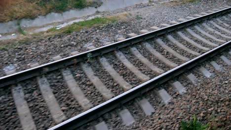 camera moves along railway, rails by night. seamless loop.