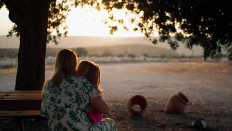 Mother-and-daughter-admiring-view-in-mountains