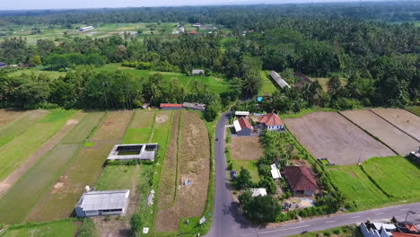 Lifting-aerial-shot-revealing-an-intersection-and-town-in-Bali