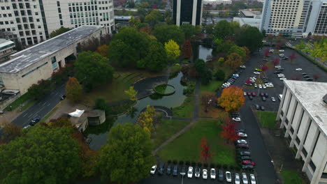 marshall park with lake in uptown charlotte, north carolina, usa. - aerial shot