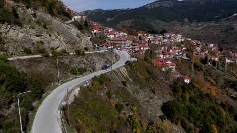 aerial drone view of famous metsovo when a car pass in epirus in greece