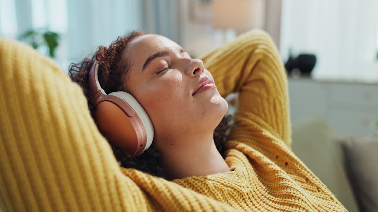 Woman relaxing with headphones listening to music