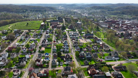 high aerial of city in appalachian mountains on sunny day