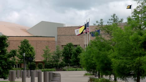 Flags-flying-on-the-campus-of-Notre-Dame-University-in-South-Bend,-Indiana-with-stable-video-shot