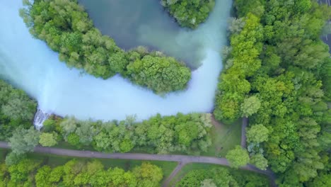 roads along lush forest by the lake, bochum werne, germany