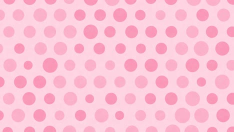 pink polka dots move on a background.