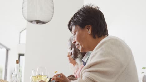 Happy-senior-diverse-people-having-dinner-at-retirement-home