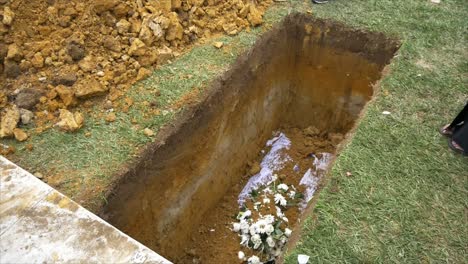 closeup shot of a funeral casket in a hearse or chapel or burial at cemetery