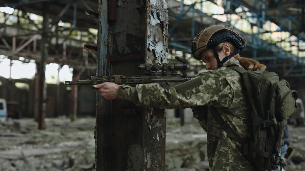 Female Soldier with Rifle in a War Zone