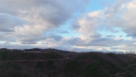 aerial shot of clouds at golden hour over the mountains in gatlinburg, tn.