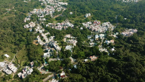 Drone-tilt-shot-of-crowded-housing-and-residential-in-Hongkong-city,-China