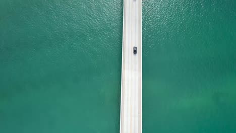 Cars-driving-over-bridge,-surrounded-by-ocean---overseas-highway-florida-keys